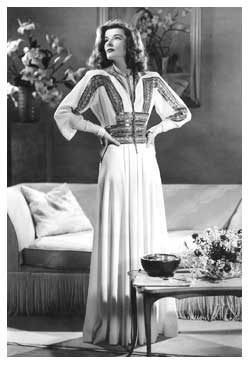 Photograph of Katherine Hepburn in a full-length Adrian gown