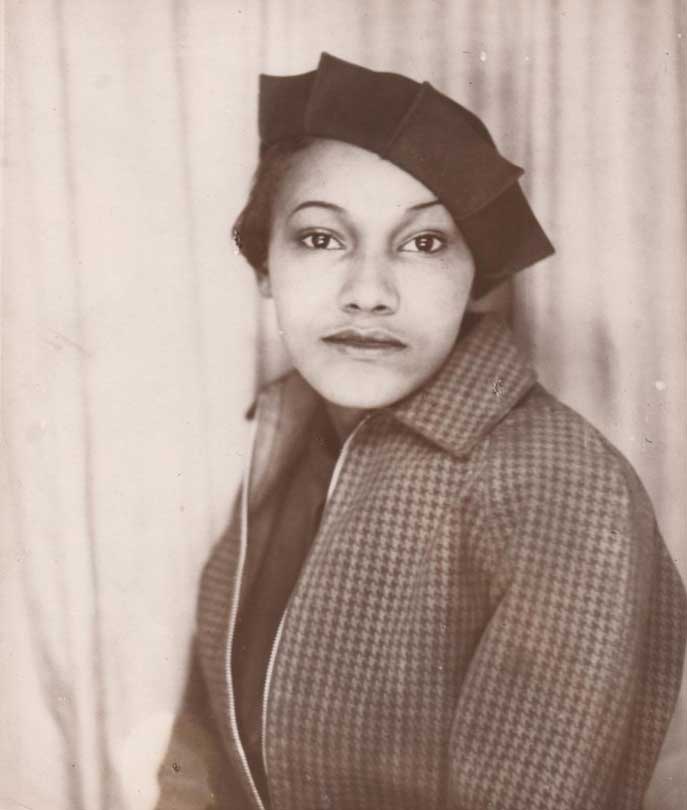 Black and white image of a woman looking at the viewer