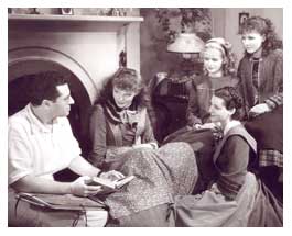 Photograph of Katharine Hepburn with George Cukor and cast in "Little Women," RKO, 1933