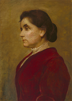 bust length portrait of a woman in a red dress
