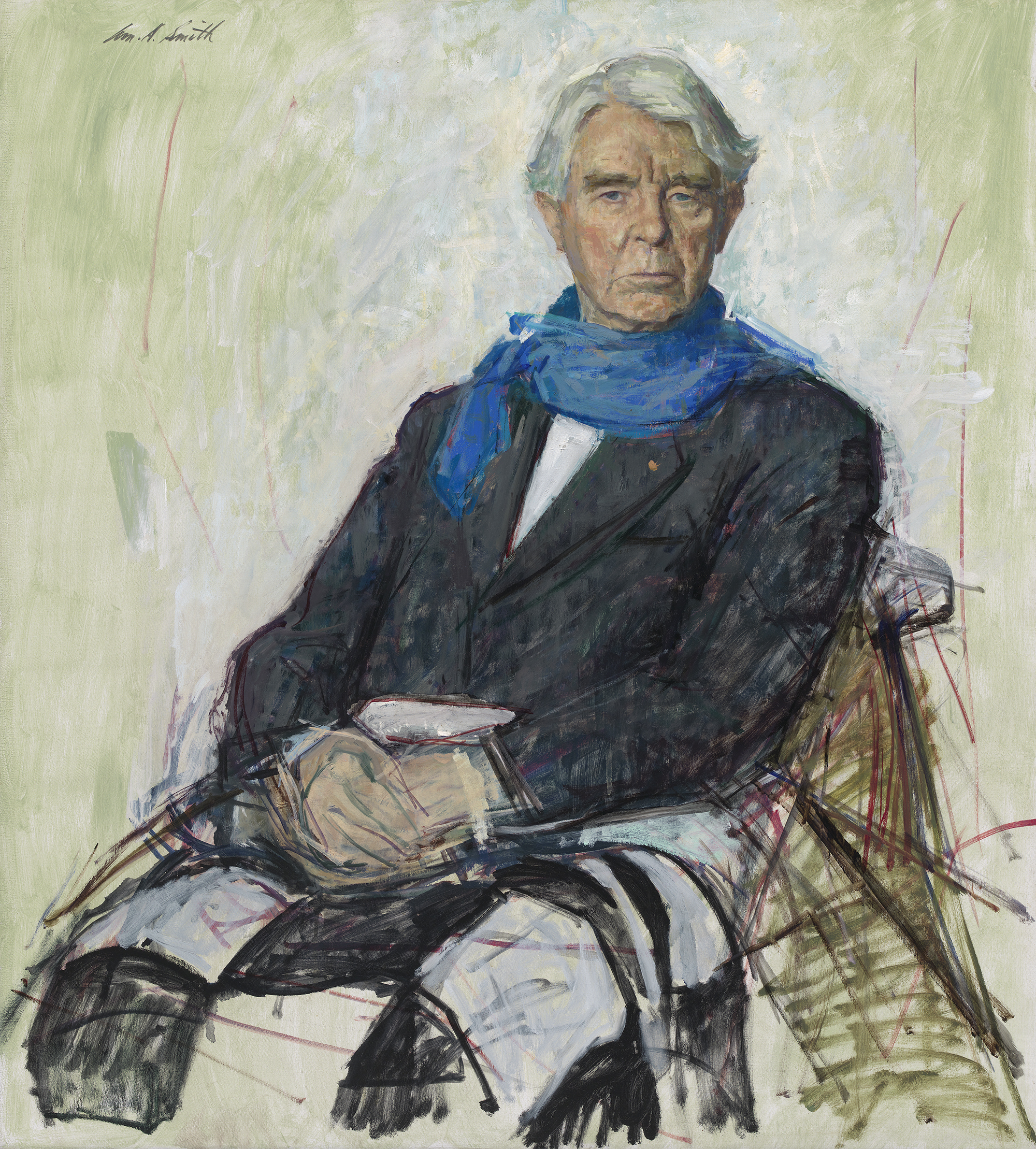 3/4 length view of a man with a colorful blanket over his lap