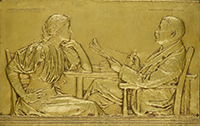 bas relief of a man and woman reading