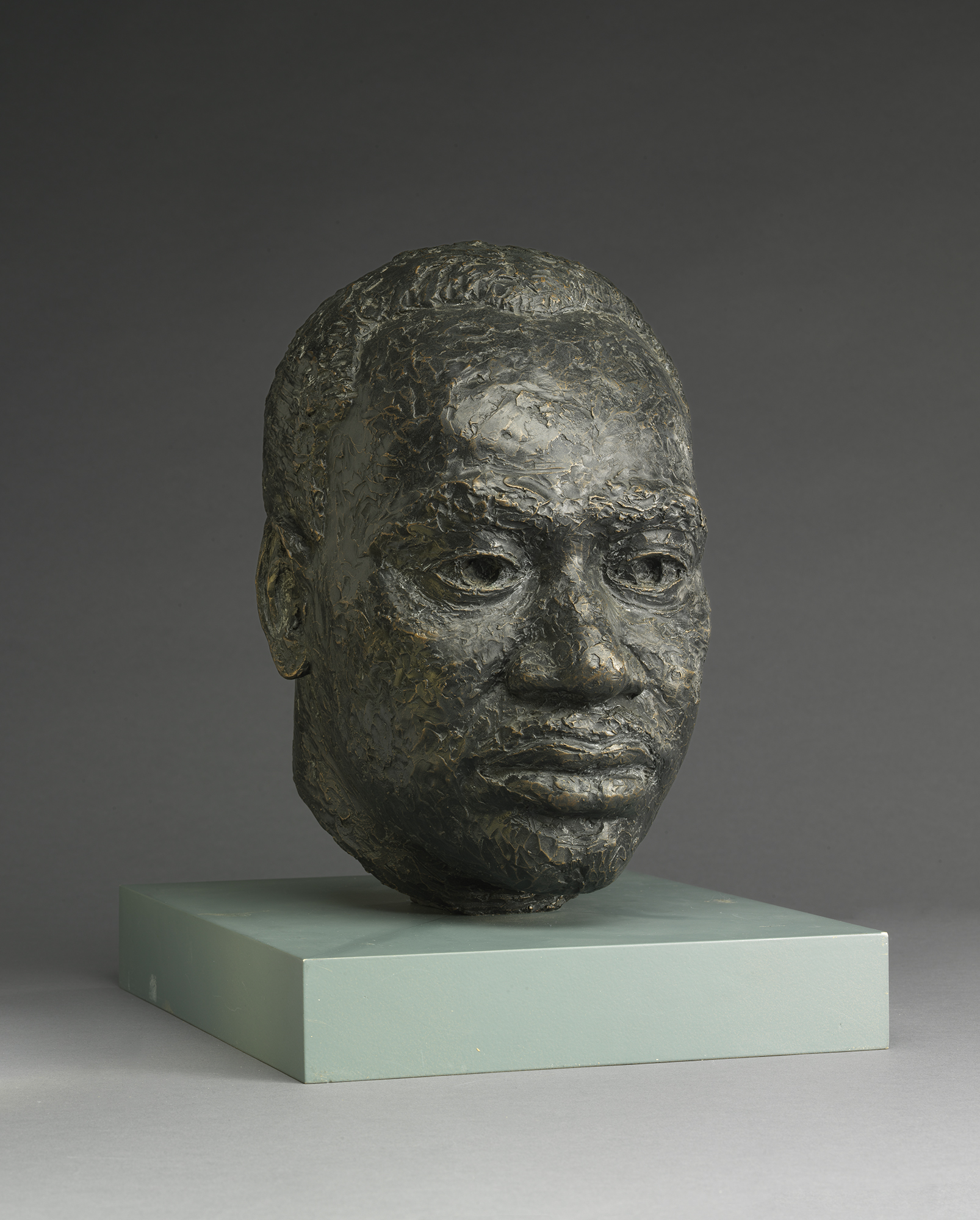 sculpted bronze head of a Black man