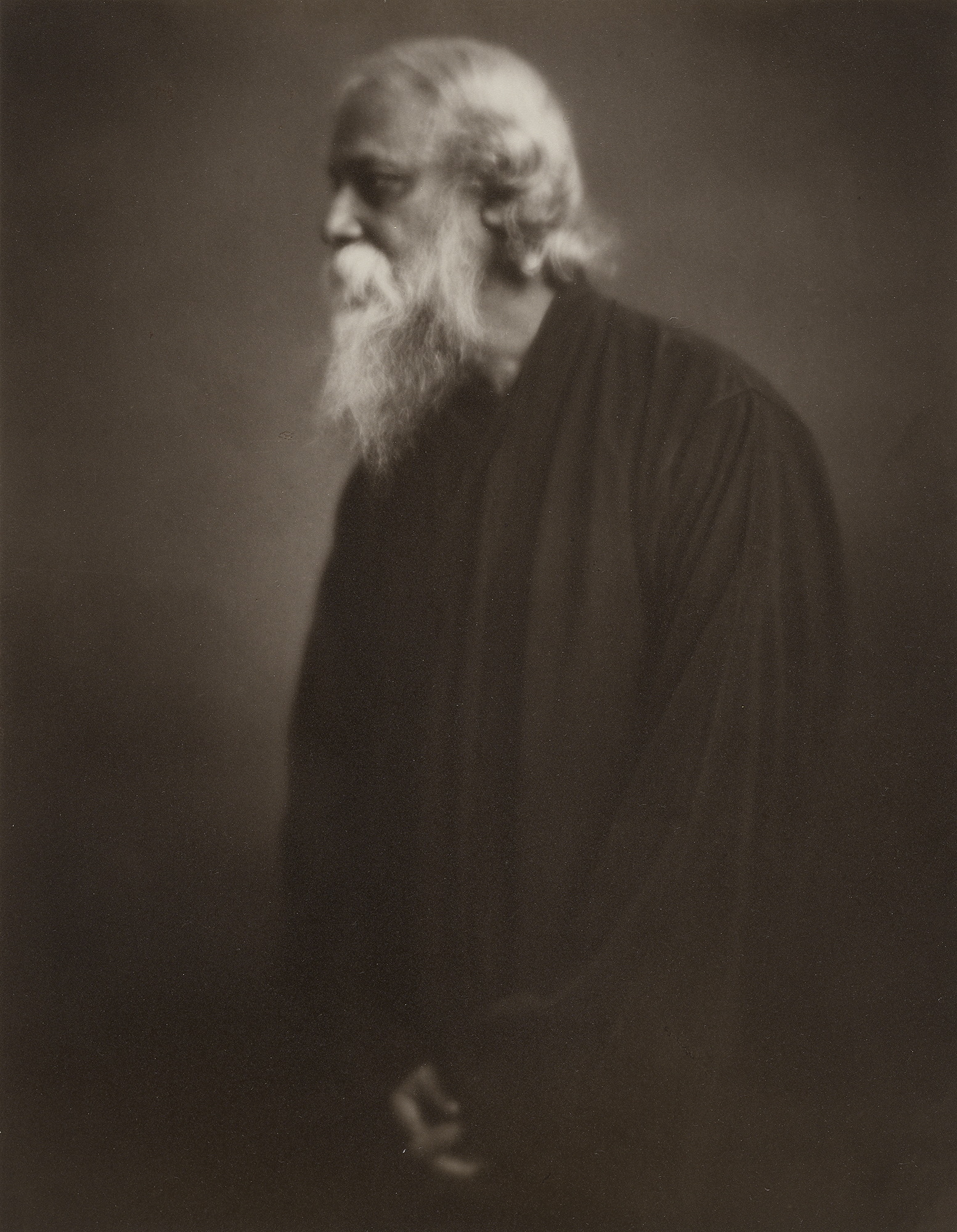 sepia tinted photo of a man with long white hair and beard