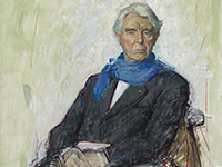 knee-length portrait of a seated man with gray hair