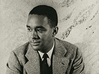 portrait of a Black man in a tweed jacket