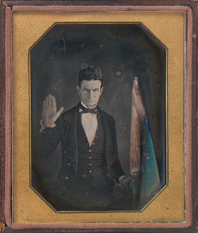 daguerreotype fo a man with his hand raised