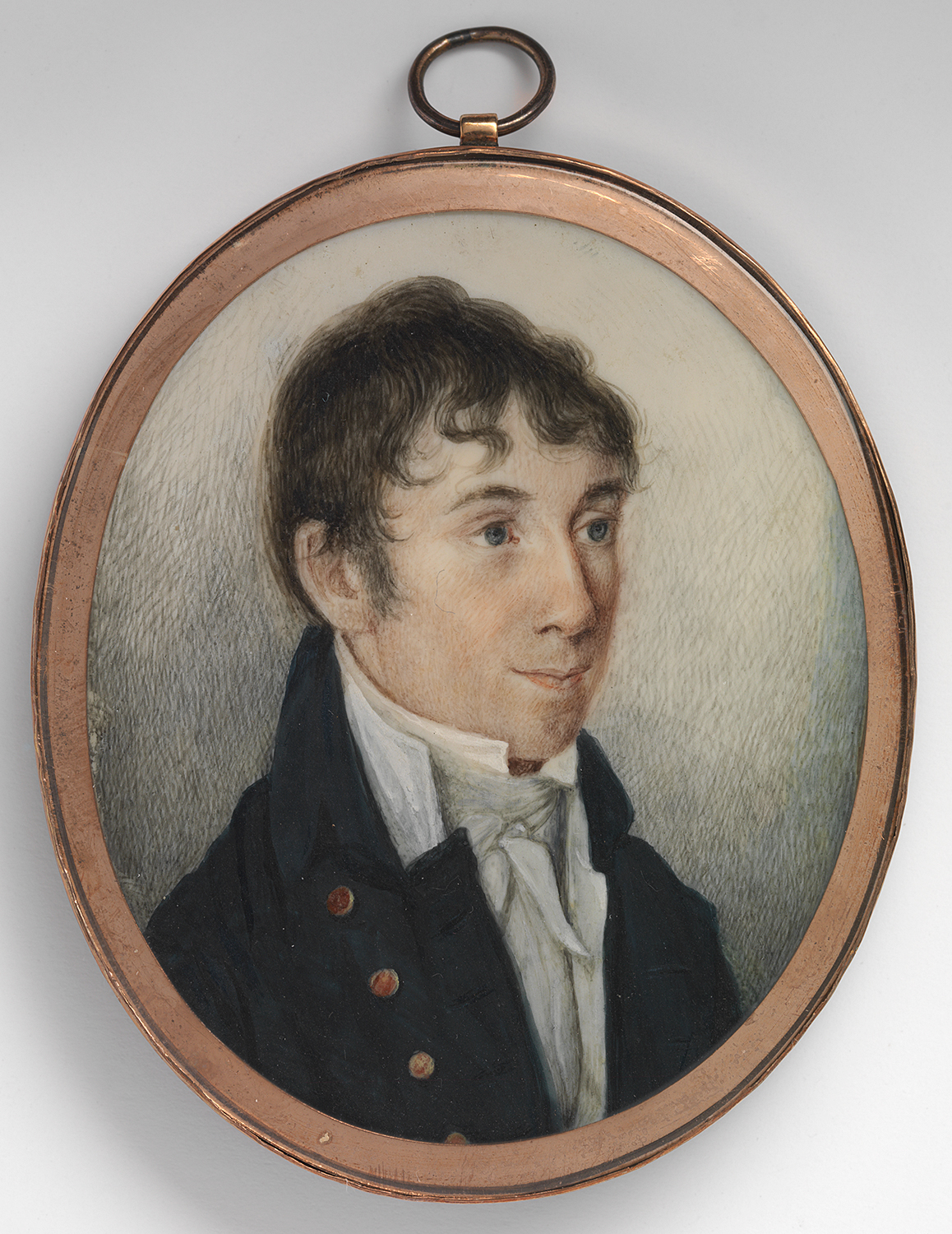 Small painted portrait of a man in a gold frame