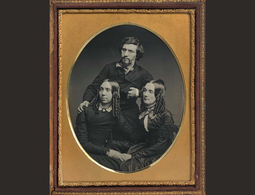 19th century portrait of one man and two women