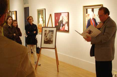 Warren Perry giving his talk on Eudora Welty and standing next to her portrait