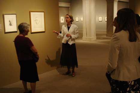 Wendy Wick Reaves giving her talk, in front of the self-portraits of Isabel Bishop