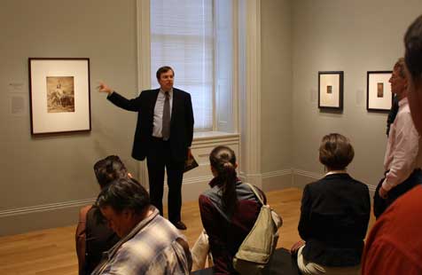 Frank Goodyear, giving his talk, standing next to Red Cloud portrait