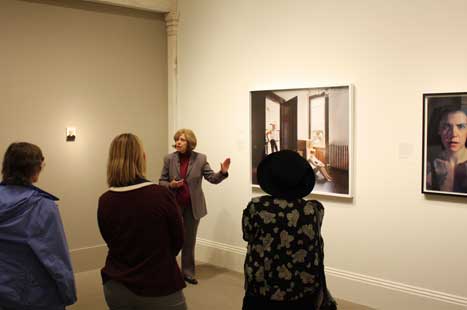 View of exhibition with curator Carolyn Carr speaking
