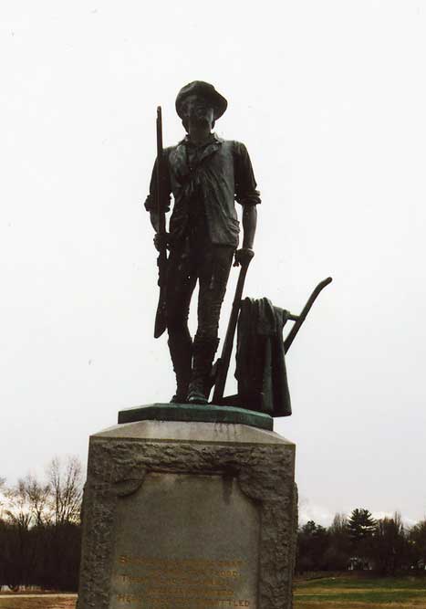 Minute Man statue -- man standing with rifle and chisel plow