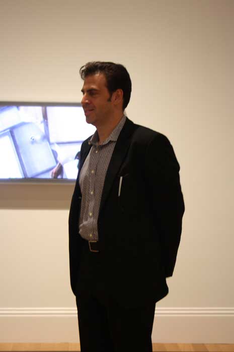 Lincoln Schatz standing in the gallery