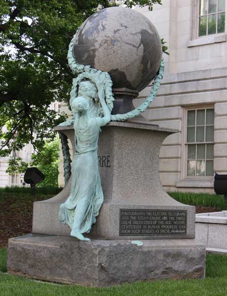 Daguerre monument -- bronze bust of Daguerre with large stone globe on top,