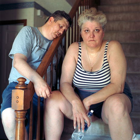 Photo of couple at home, on steps