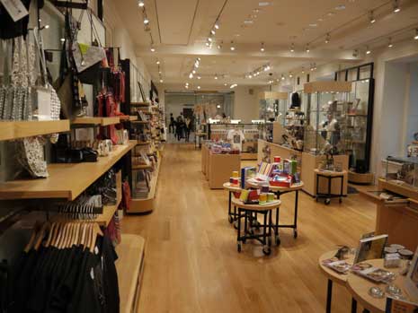 Museum store, racks of items and clothing