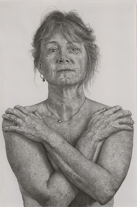 Charcoal drawing of a woman from the waist with her arms crossed over her chest, from front.