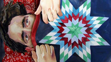 Blog_levonian Still image from the video Buffalo Milk Yogurt, showing a man underneath a colorful blanket.