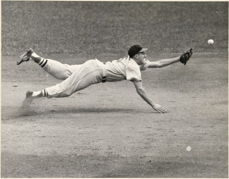 Brooksrobinson Black and white photo of Brooks Robinson diving for a catch