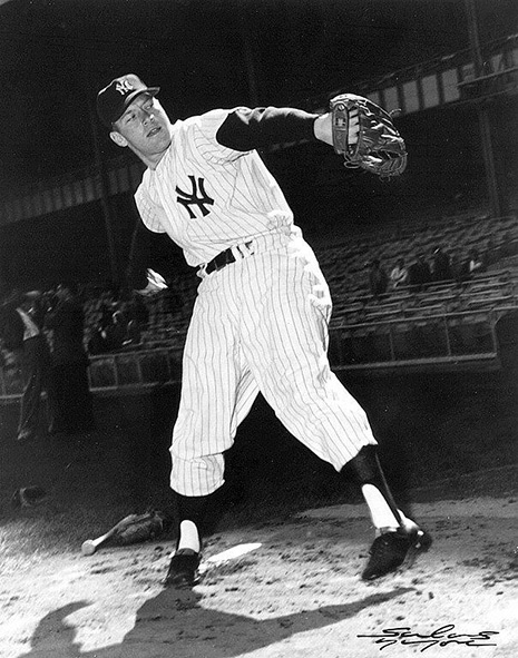 Mantle Black and white photo of Mickey Mantle in Yankees uniform, throwing a ball