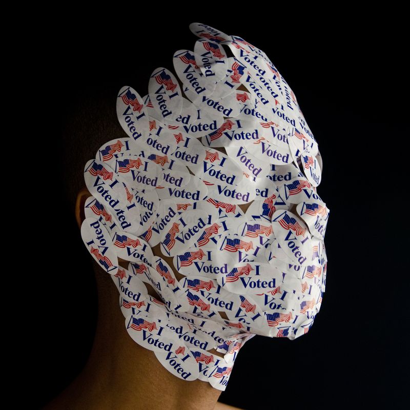 Wilmer Wilson's face covered with "I voted" stickers
