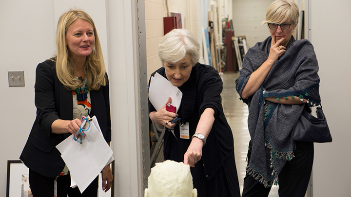 curatorial judges looking at art