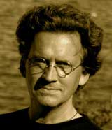 Sepia-toned black and white photo of artist Bo Bartlett from the shoulders up.