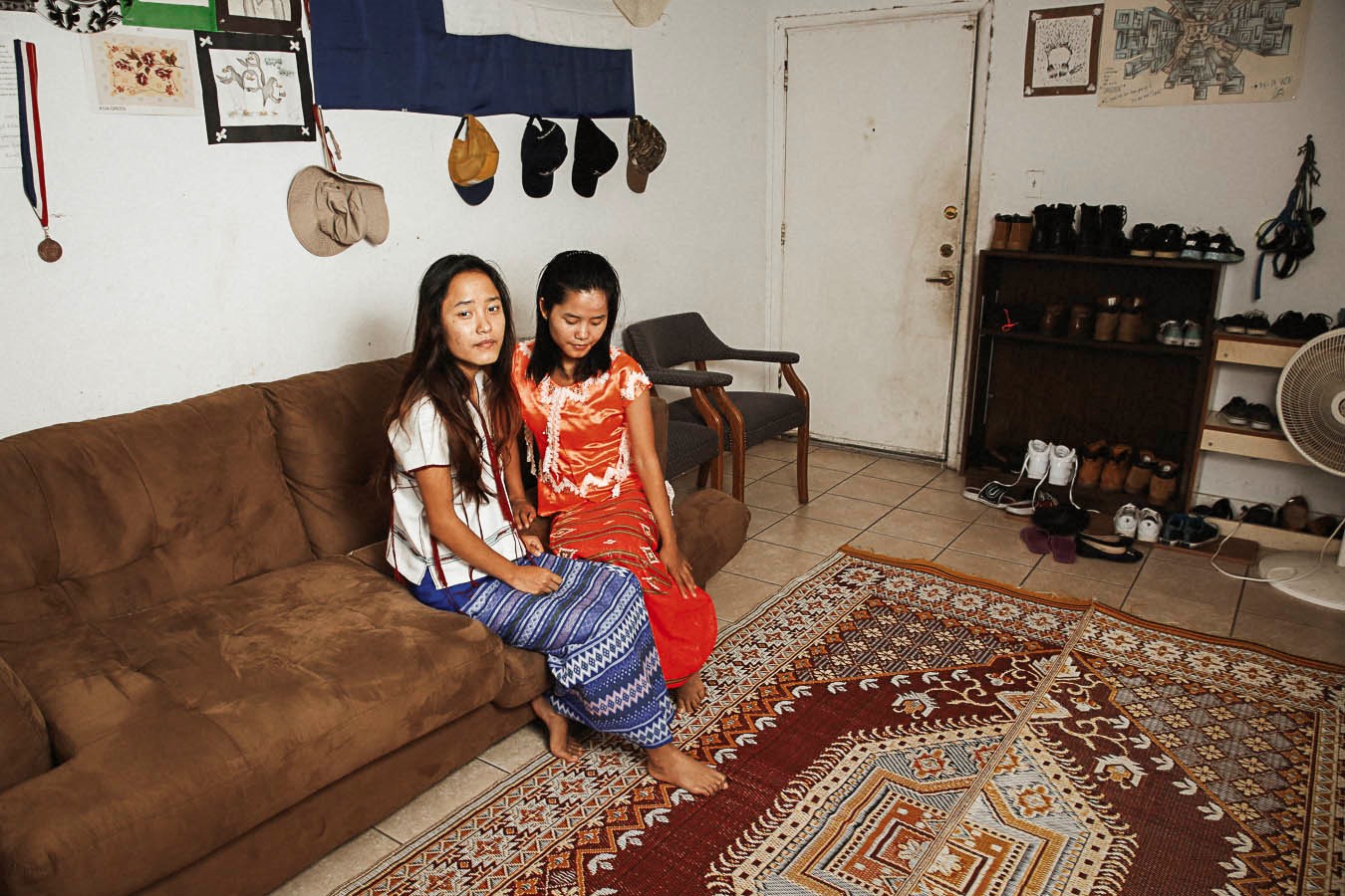 Two young women sitting on a couch