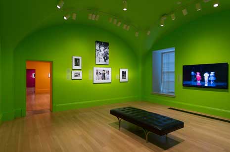 Exhibition gallery, with walls painted bright lime green