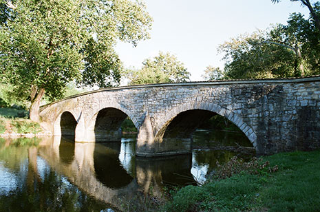 Stone arch bridge over small river