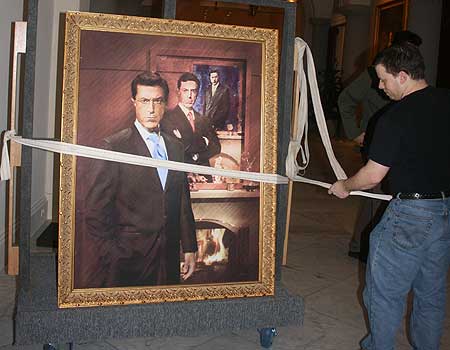 Photo of Stephen Colbert portrait being moved