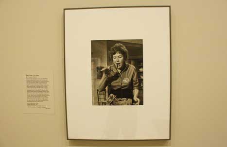 Black and white photograph of Julia Child in her kitchen