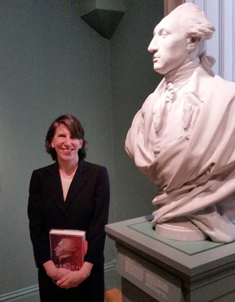Author Laura Auricchio in the museum galleries, next to bust of Lafayette