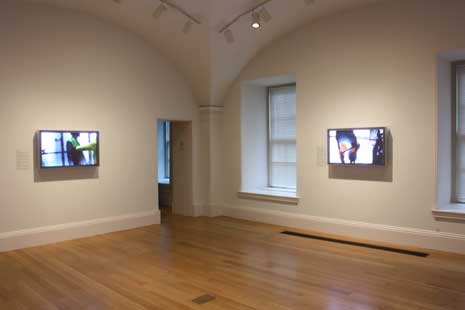 View of video screens showing LIncoln Schatz's work in the museum galleries