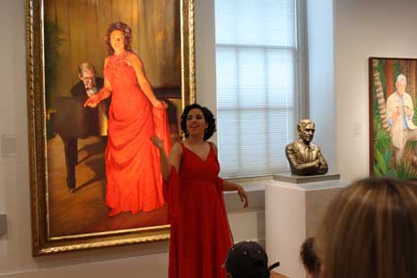 Portraits Alive performancce in front of Denyce Graves portrait in the museum galleries