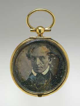 Button-sized daguerreotype portrait of Samuel Morse on decorative jewelry