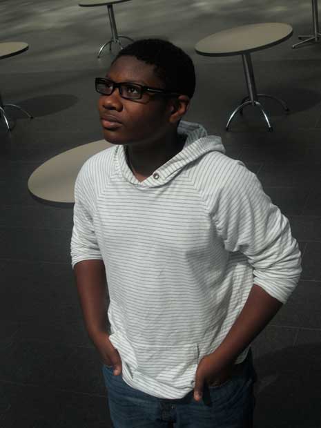 Tariq Harris in white sweatshirt. looking upwards