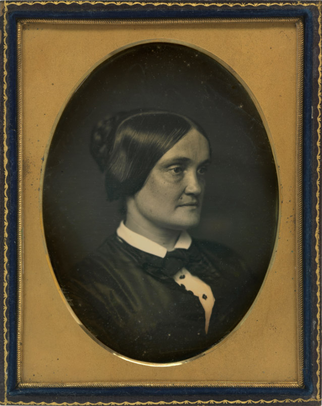 3/4 profile of a woman in a bow-tie