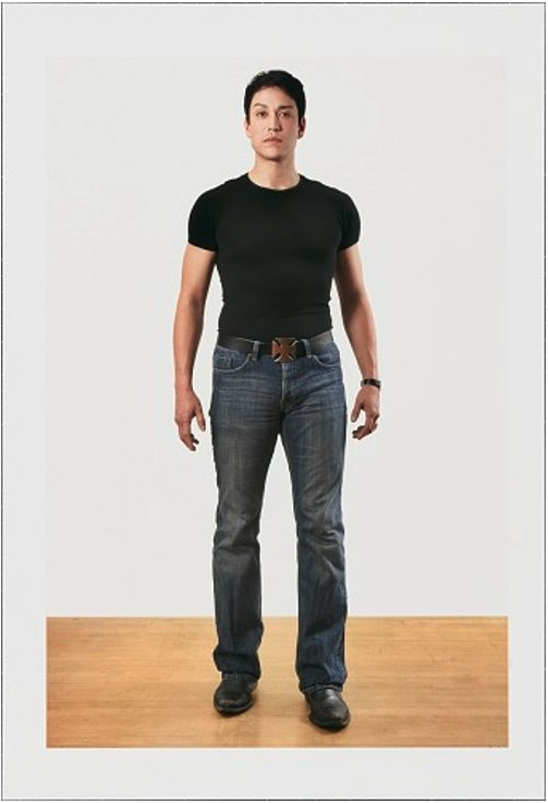full length portrait of a man in a black t-shirt and black jeans