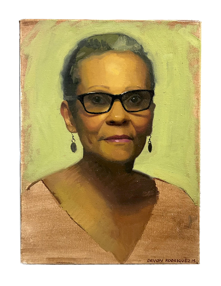 Portrait of an African American woman with short hair and glasses