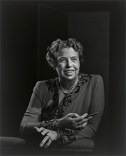 black and white photo of a woman with arms crossed