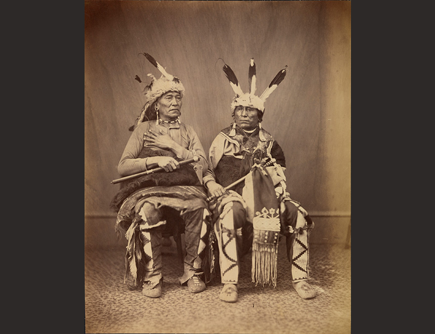 Two seated Native Americans