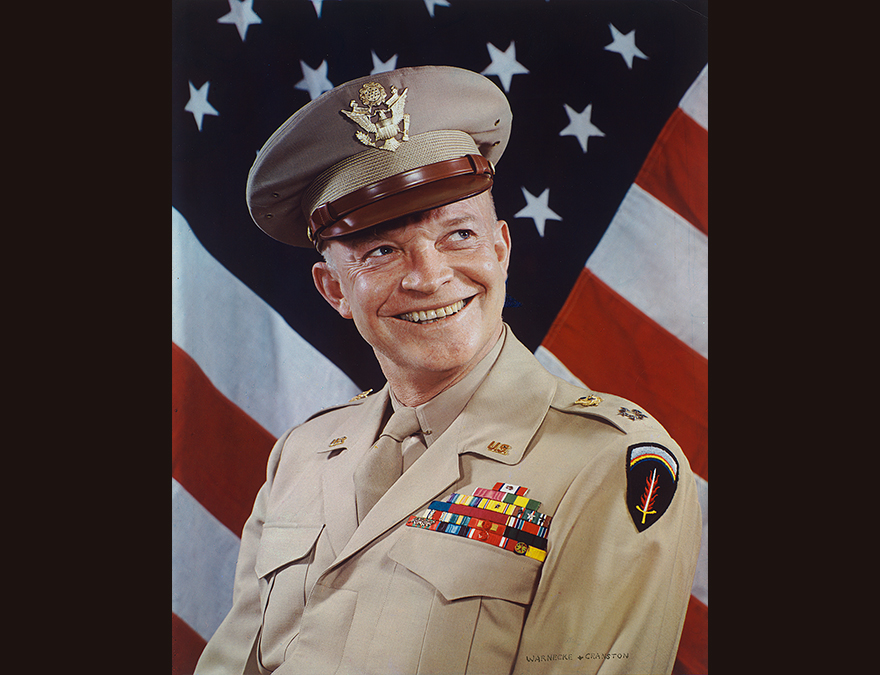 Army General in uniform in front of the American flag