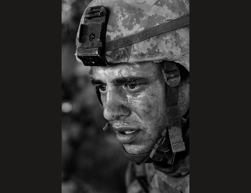 Black and white photo of a soldier in a helmet