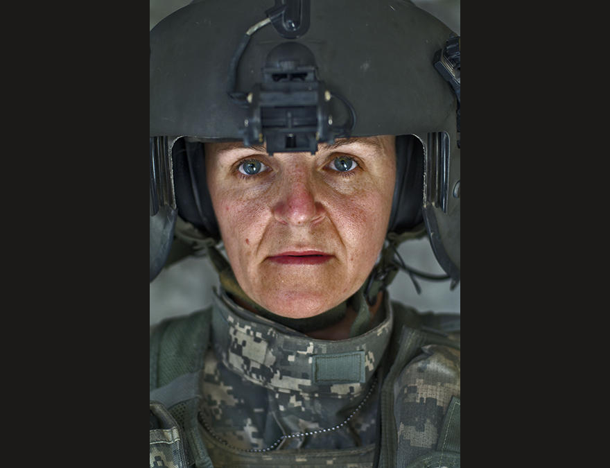 Helicopter pilot (a woman) in full combat gear