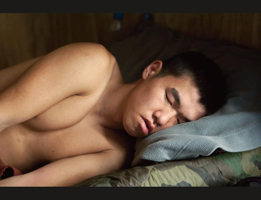 Sleeping soldier on his cot