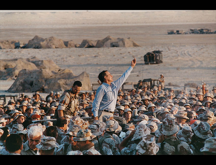 Man waving in a crowd of soldiers