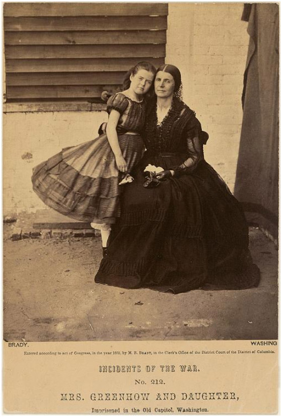 19th century woman in a black dress with her young daughter